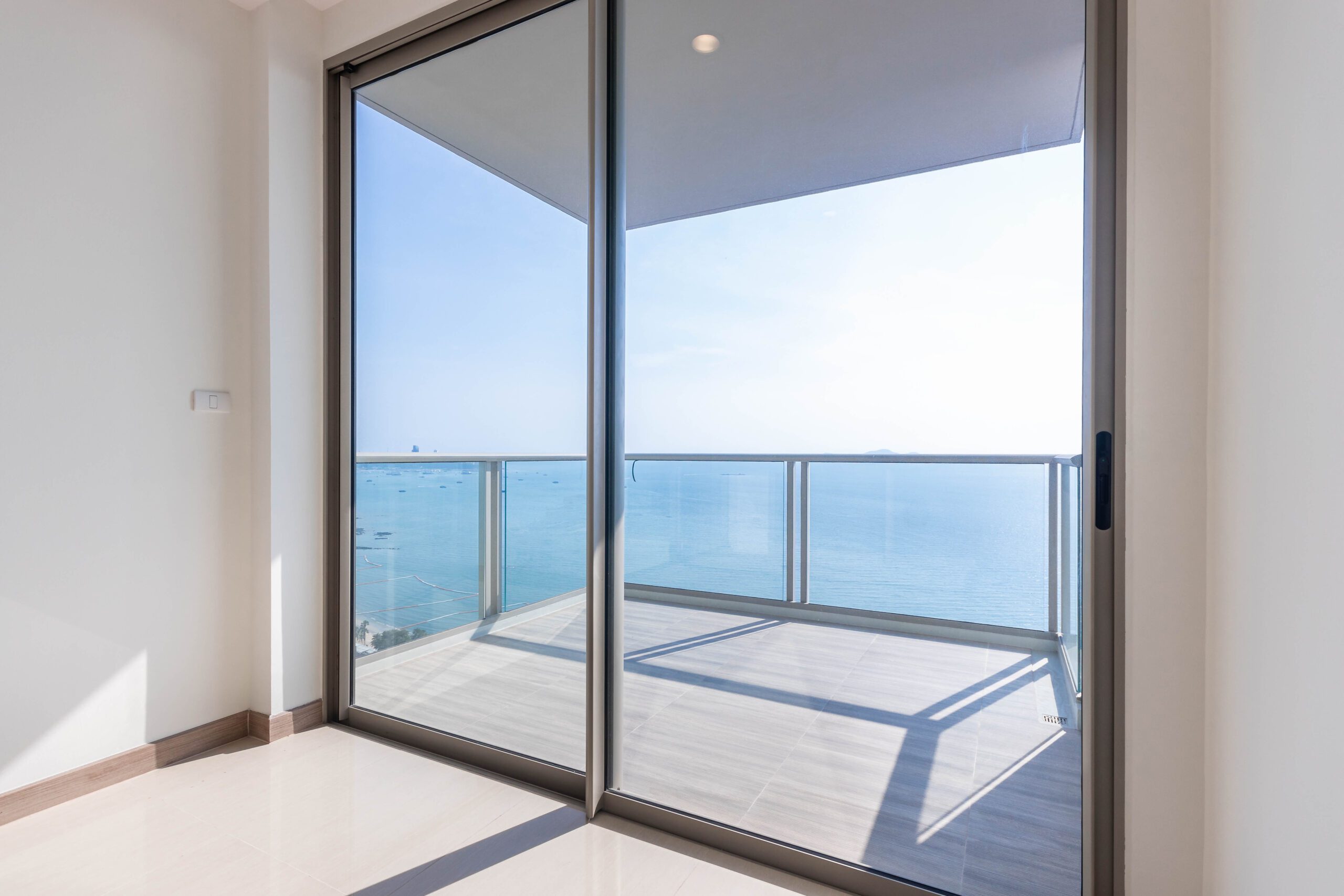 Sliding glass door replacement overlooking the sea